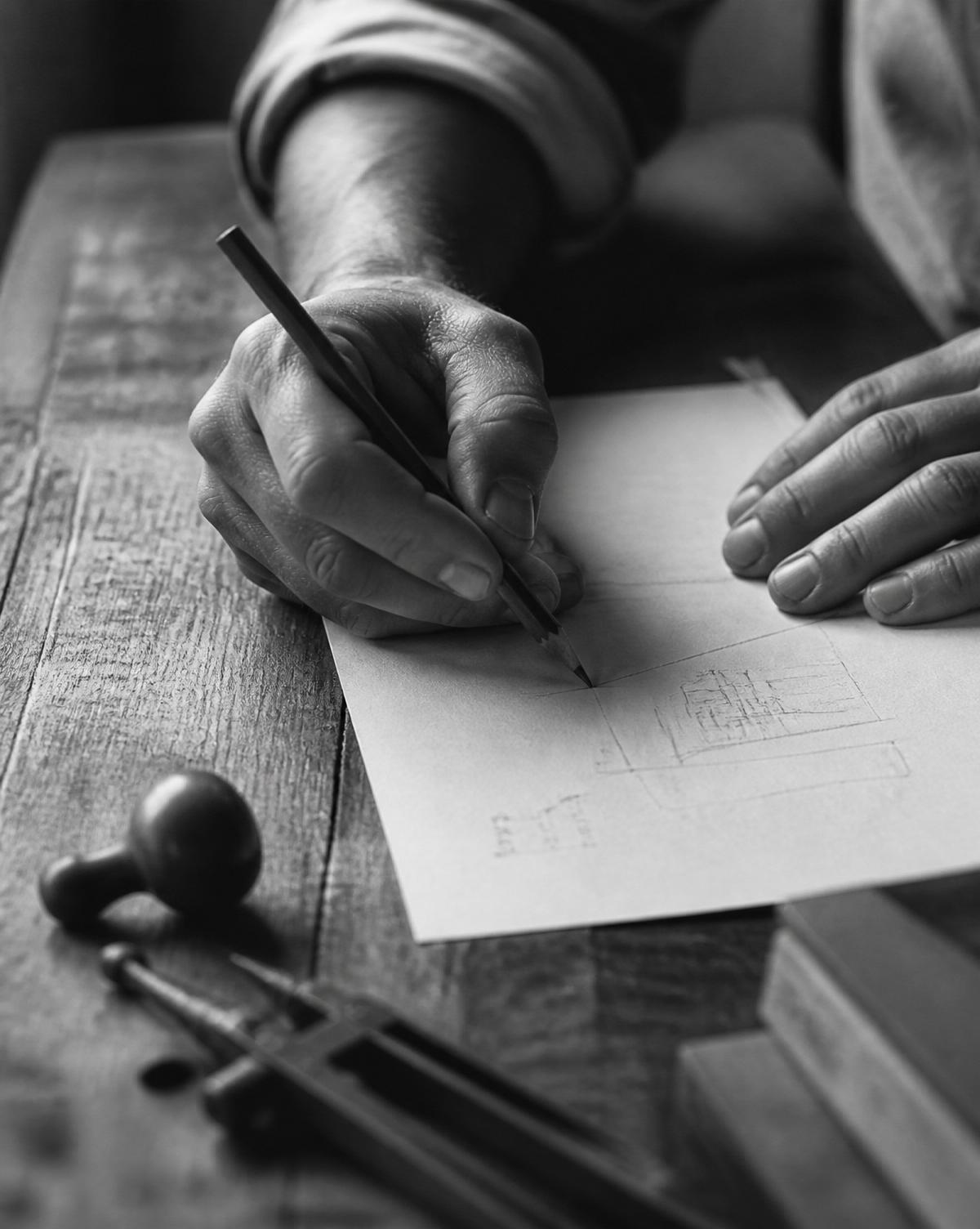 A craftsman sketching by hand